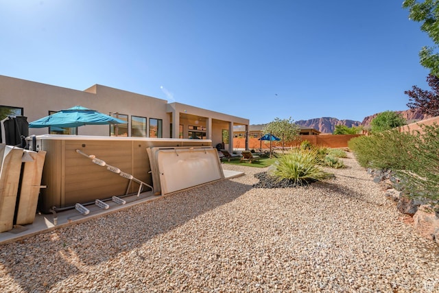 108 N Arrowhead Ln, Ivins, UT 84738 - fenced backyard with a mountain view