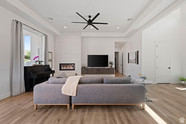 108 N Arrowhead Ln, Ivins, UT 84738 - living room featuring a ceiling fan, light wood-style flooring, baseboards, a large fireplace, and recessed lighting