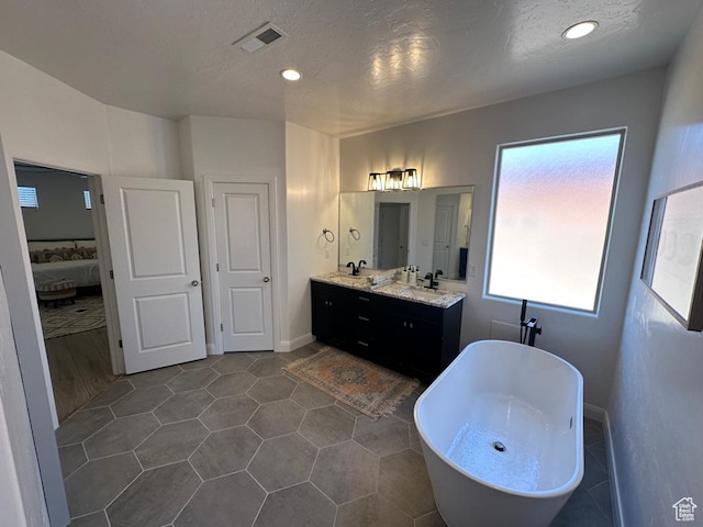 2786 S 3780 W, Hurricane, UT 84737 - bathroom with a freestanding bath, double vanity, connected bathroom, and recessed lighting