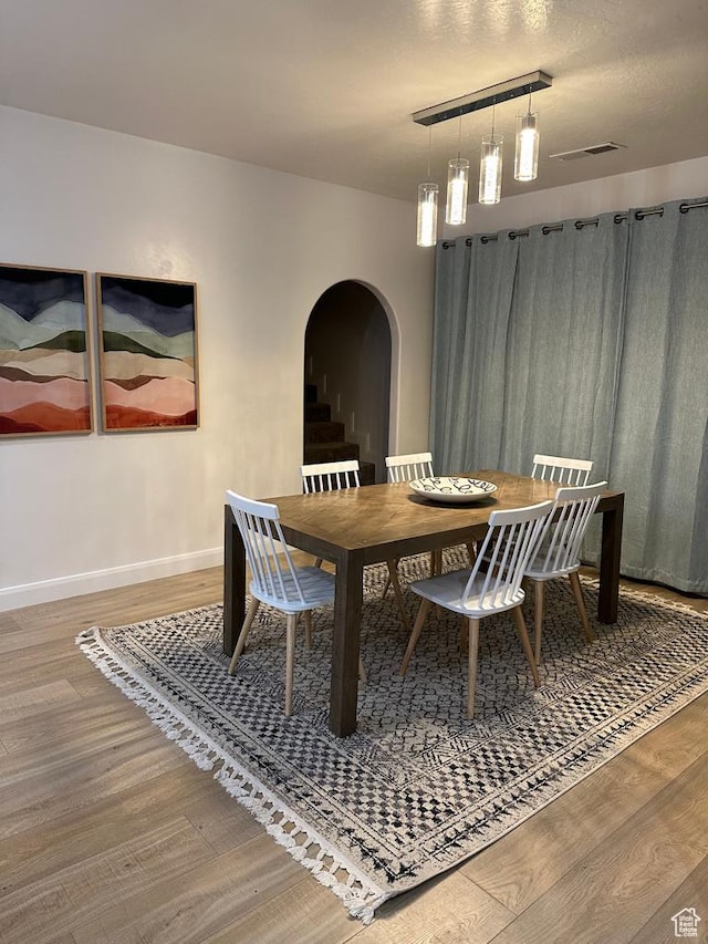 2786 S 3780 W, Hurricane, UT 84737 - dining area featuring arched walkways, wood finished floors, and baseboards