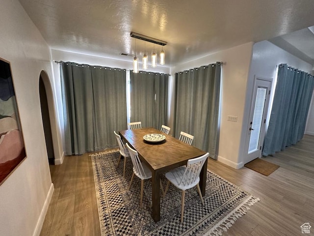 2786 S 3780 W, Hurricane, UT 84737 - dining room featuring wood finished floors, arched walkways, and baseboards