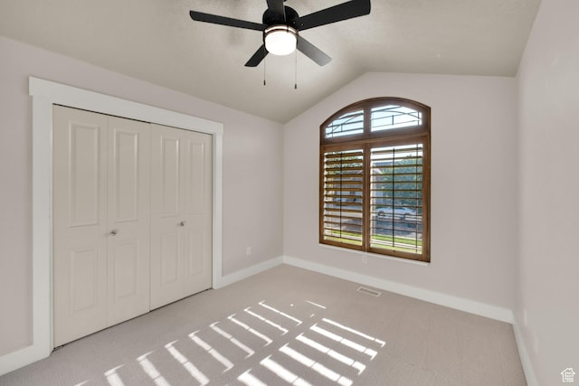 4836 S 5050 W, Hooper, UT 84315 - unfurnished bedroom featuring carpet floors, baseboards, vaulted ceiling, a closet, and a ceiling fan