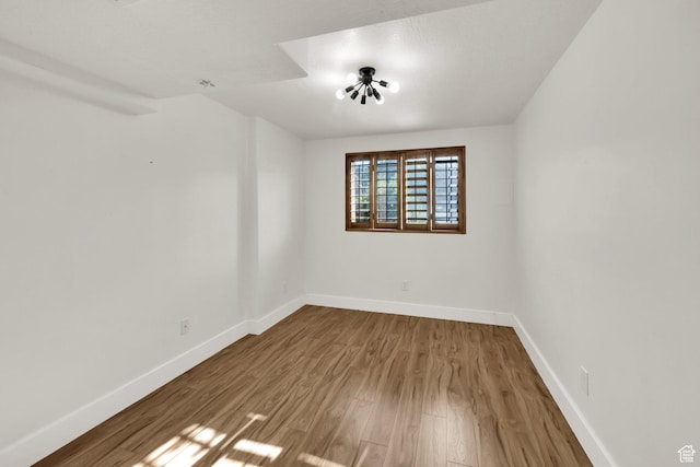 4836 S 5050 W, Hooper, UT 84315 - spare room featuring wood finished floors and baseboards