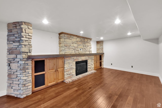 4836 S 5050 W, Hooper, UT 84315 - unfurnished living room featuring a fireplace, baseboards, wood finished floors, and recessed lighting