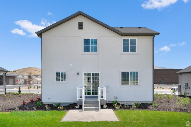 6747 N Tulle Mtn, Eagle Mountain, UT 84005 - rear view of property with a lawn, stucco siding, a mountain view, and a patio area
