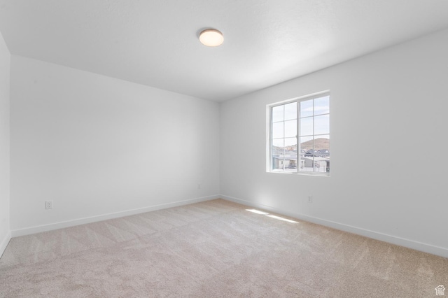 6747 N Tulle Mtn, Eagle Mountain, UT 84005 - carpeted spare room featuring baseboards