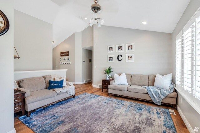 7371 N Ute Dr, Eagle Mountain, UT 84005 - living room featuring wood finished floors, vaulted ceiling, baseboards, and recessed lighting