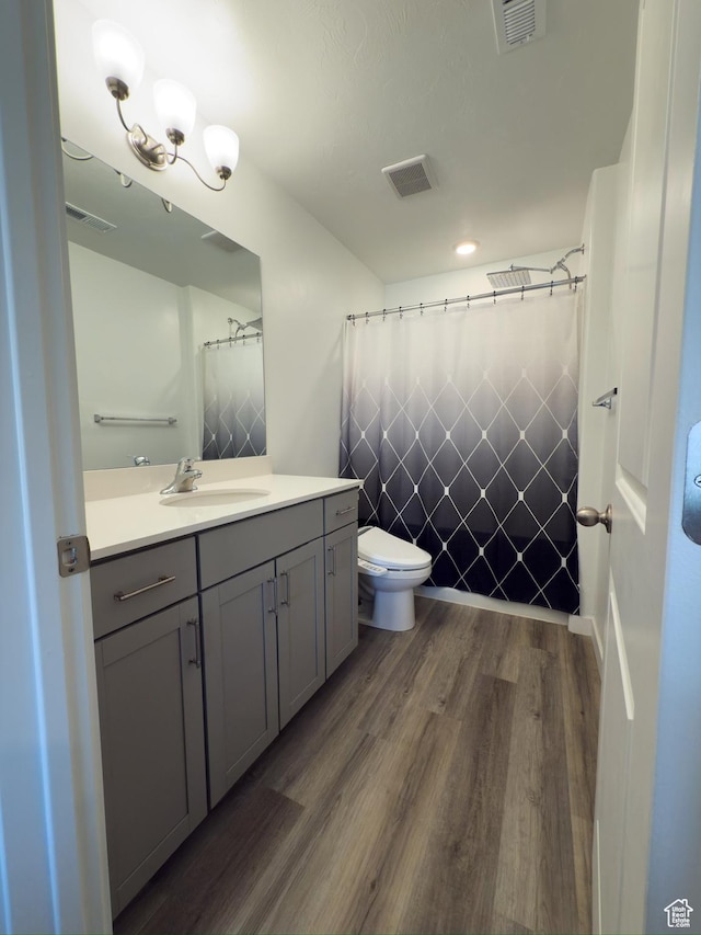 1764 E Fall St, Eagle Mountain, UT 84005 - full bathroom with wood finished floors, vanity, toilet, and curtained shower