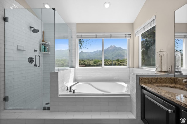 4601 S Farm Meadow Ln, Millcreek, UT 84117 - bathroom featuring a mountain view, vanity, a garden tub, a shower stall, and recessed lighting