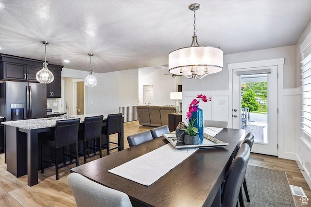 2548 E Ember Dr, Draper Ut Cnty, UT 84020 - dining room featuring light wood-style flooring and a chandelier