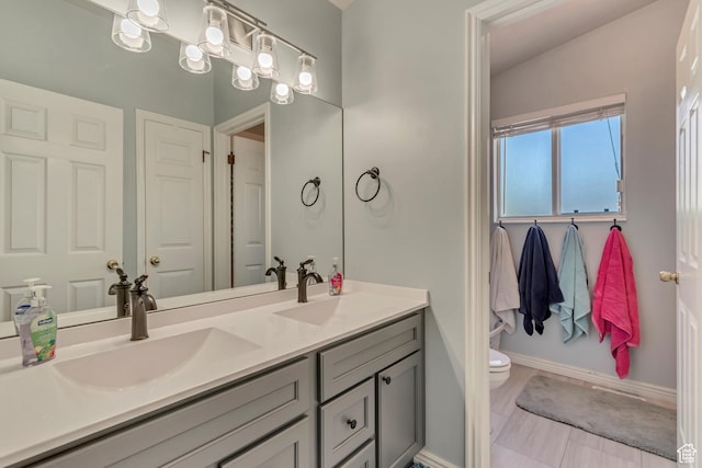 2761 W 9800 S, South Jordan, UT 84095 - bathroom with double vanity, toilet, and baseboards