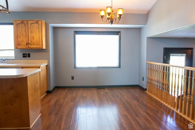 2182 W 1145 N, Clinton, UT 84015 - unfurnished dining area featuring a chandelier, dark wood-type flooring, and plenty of natural light
