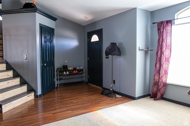2182 W 1145 N, Clinton, UT 84015 - entryway with stairway, wood finished floors, baseboards, and a textured ceiling