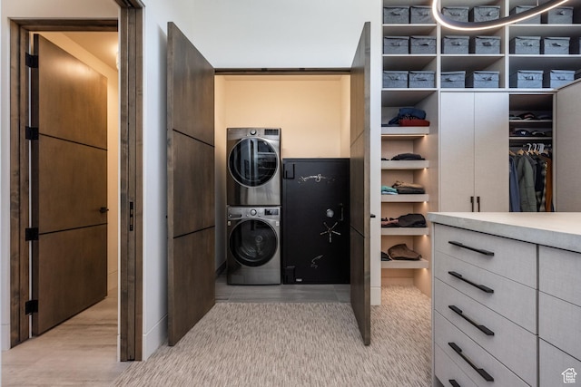 7744 E Moon Dance Cir, Kamas, UT 84036 - laundry room featuring stacked washer and clothes dryer and wood finished floors