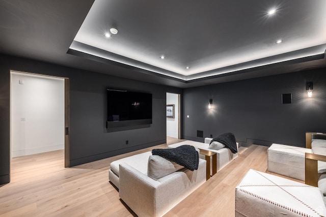 7744 E Moon Dance Cir, Kamas, UT 84036 - home theater room with light wood-style flooring, a raised ceiling, and recessed lighting