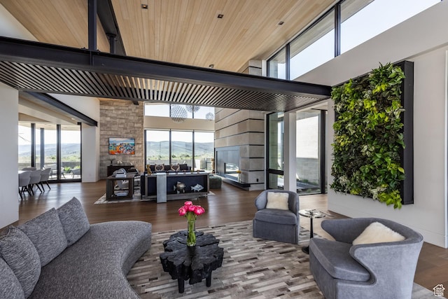7744 E Moon Dance Cir, Kamas, UT 84036 - living area featuring a towering ceiling, wood finished floors, and a fireplace