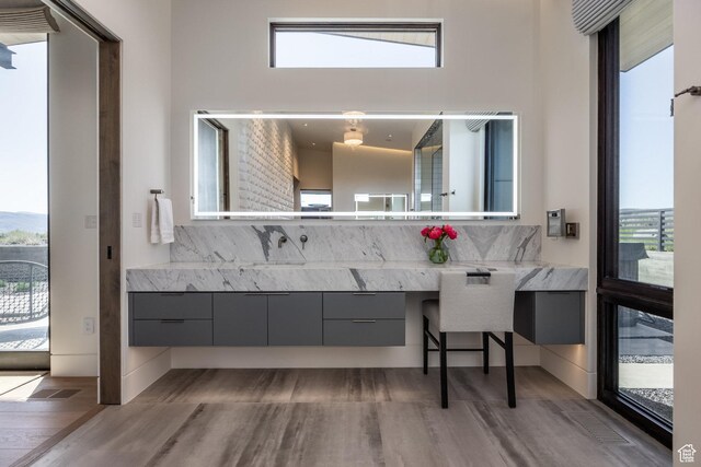 7744 E Moon Dance Cir, Kamas, UT 84036 - bathroom with wood finished floors, tasteful backsplash, plenty of natural light, and vanity