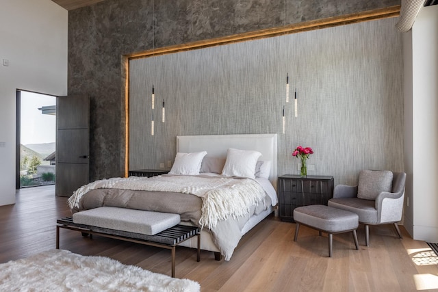 7744 E Moon Dance Cir, Kamas, UT 84036 - bedroom featuring a towering ceiling and wood finished floors
