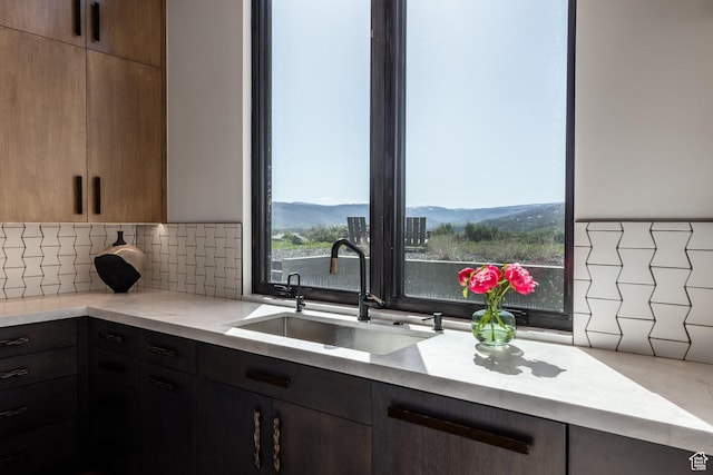 7744 E Moon Dance Cir, Kamas, UT 84036 - kitchen featuring a sink, backsplash, and modern cabinets
