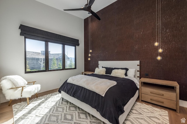 7744 E Moon Dance Cir, Kamas, UT 84036 - bedroom featuring wood finished floors, ceiling fan, and baseboards