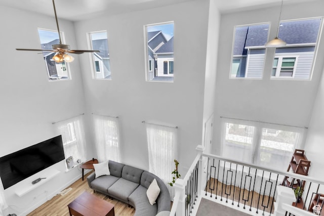 1994 N 3900 W Unit 217, Lehi, UT 84043 - living area with a high ceiling, ceiling fan, and wood finished floors