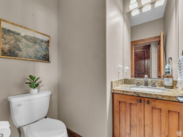 2894 E Cobblemoor Ln, Sandy, UT 84093 - half bathroom featuring toilet, vanity, and baseboards