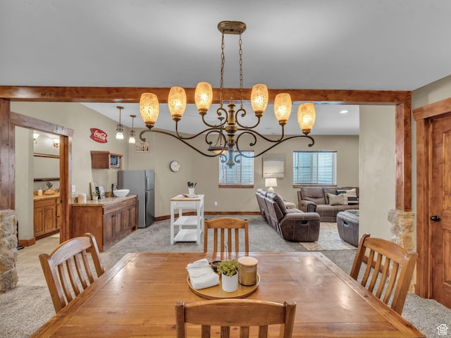 2894 E Cobblemoor Ln, Sandy, UT 84093 - dining space featuring light colored carpet, a chandelier, baseboards, and beam ceiling