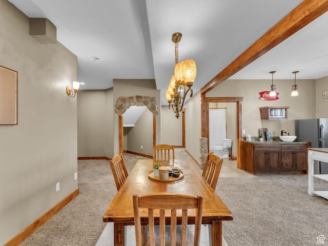 2894 E Cobblemoor Ln, Sandy, UT 84093 - dining room featuring light carpet, a chandelier, and baseboards