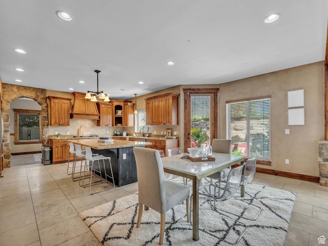 2894 E Cobblemoor Ln, Sandy, UT 84093 - dining room with recessed lighting, light tile patterned floors, baseboards, and arched walkways