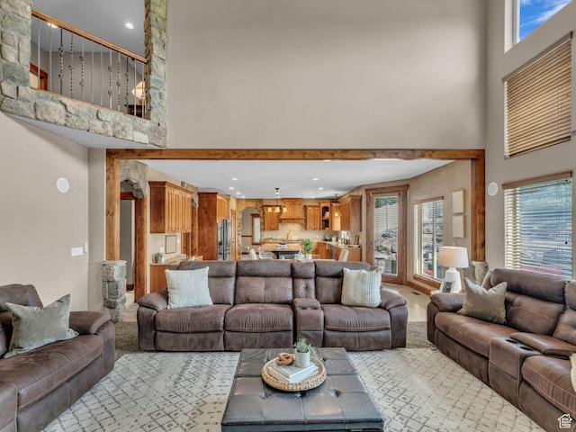 2894 E Cobblemoor Ln, Sandy, UT 84093 - carpeted living area featuring a high ceiling, plenty of natural light, and recessed lighting