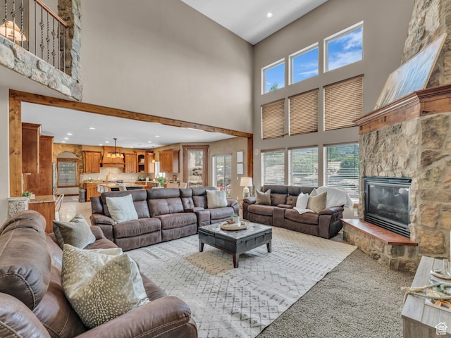 2894 E Cobblemoor Ln, Sandy, UT 84093 - living room with a towering ceiling, a fireplace, recessed lighting, and light colored carpet