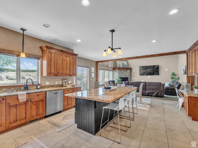 2894 E Cobblemoor Ln, Sandy, UT 84093 - kitchen with stainless steel dishwasher, a sink, light stone countertops, a center island, and brown cabinetry