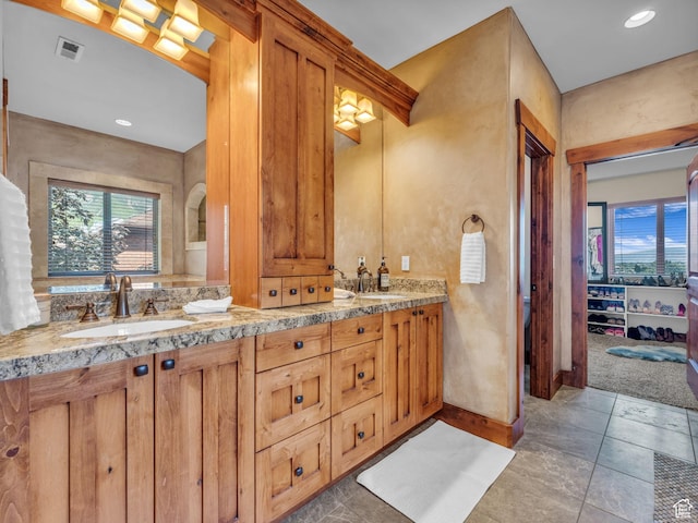 2894 E Cobblemoor Ln, Sandy, UT 84093 - bathroom with healthy amount of natural light, double vanity, baseboards, and recessed lighting