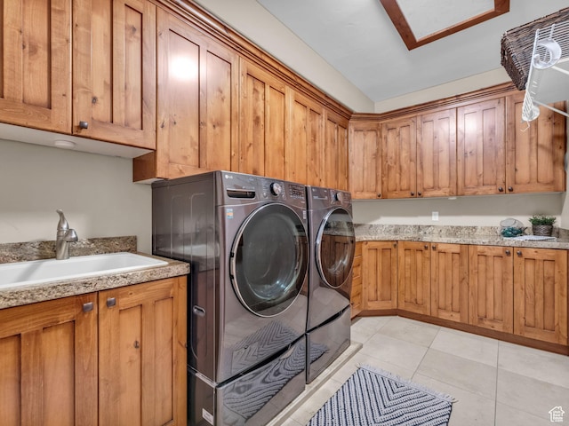 2894 E Cobblemoor Ln, Sandy, UT 84093 - laundry area featuring cabinet space, washing machine and dryer, and light tile patterned flooring