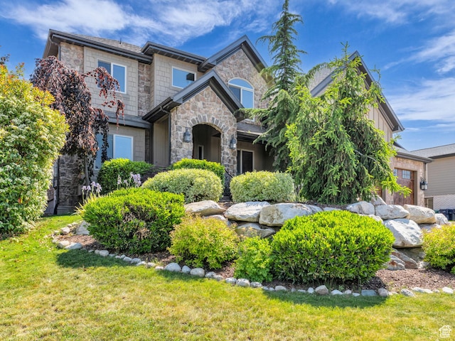 2894 E Cobblemoor Ln, Sandy, UT 84093 - view of front facade featuring stone siding and a front lawn