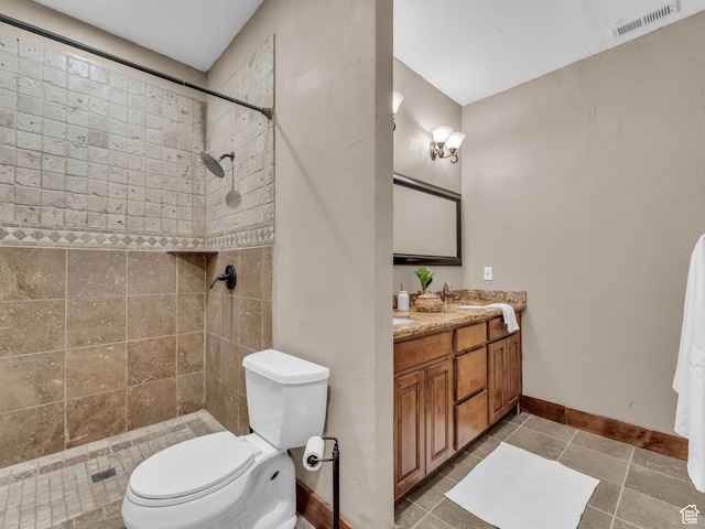 2894 E Cobblemoor Ln, Sandy, UT 84093 - full bathroom featuring double vanity, toilet, baseboards, a tile shower, and tile patterned flooring