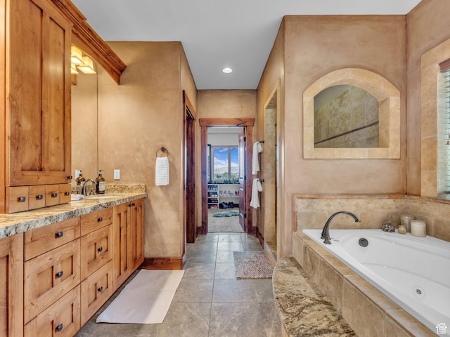 2894 E Cobblemoor Ln, Sandy, UT 84093 - ensuite bathroom with a jetted tub, vanity, and baseboards