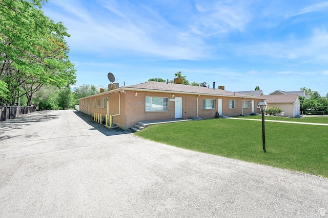 10679 S 2200 W, South Jordan, UT 84095 - ranch-style home with brick siding and a front lawn