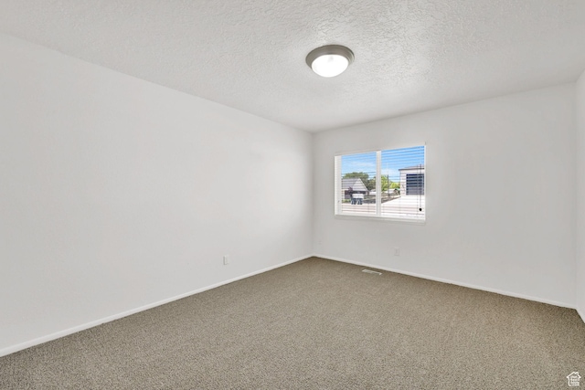 10679 S 2200 W, South Jordan, UT 84095 - spare room with dark colored carpet, a textured ceiling, and baseboards