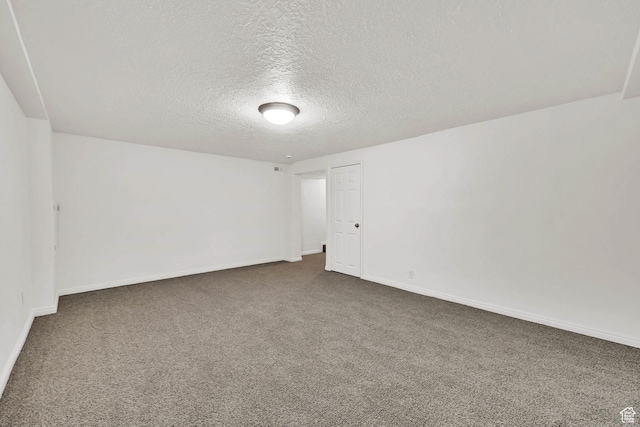 10679 S 2200 W, South Jordan, UT 84095 - spare room with dark colored carpet, a textured ceiling, and baseboards