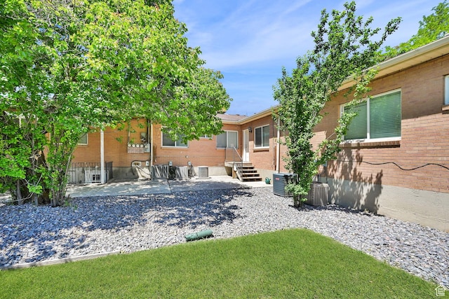 10679 S 2200 W, South Jordan, UT 84095 - view of yard featuring a patio area and central AC unit
