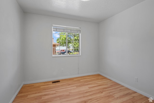 58 S 900 E, Spanish Fork, UT 84660 - spare room featuring wood finished floors, baseboards, and a textured ceiling