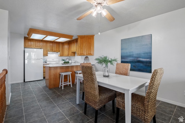 58 S 900 E, Spanish Fork, UT 84660 - dining area with dark tile patterned flooring, ceiling fan, and baseboards