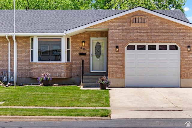 58 S 900 E, Spanish Fork, UT 84660 - view of front of property with concrete driveway, roof with shingles, a front lawn, brick siding, and an attached garage