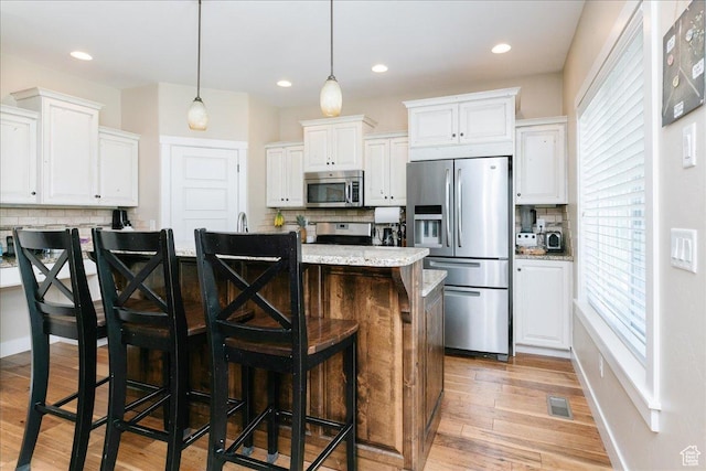 225 E 620 S, Smithfield, UT 84335 - kitchen with appliances with stainless steel finishes, decorative backsplash, white cabinets, and recessed lighting