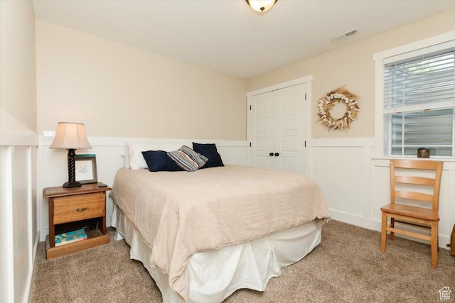 225 E 620 S, Smithfield, UT 84335 - carpeted bedroom with wainscoting, a closet, and a decorative wall