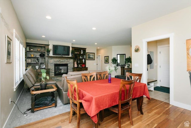 225 E 620 S, Smithfield, UT 84335 - dining space with a fireplace, wood finished floors, recessed lighting, and baseboards