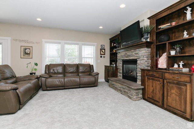 225 E 620 S, Smithfield, UT 84335 - living area featuring light carpet, a stone fireplace, and recessed lighting