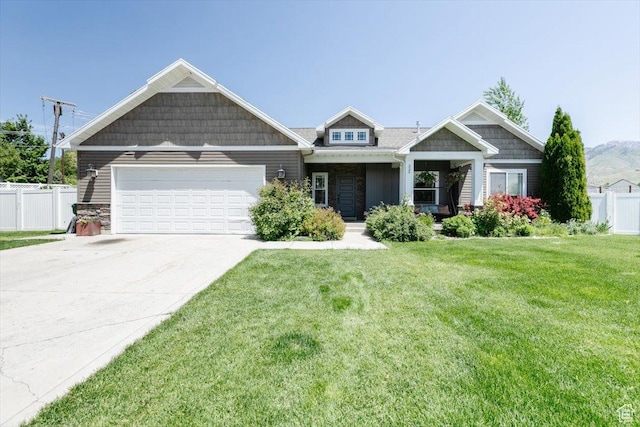 225 E 620 S, Smithfield, UT 84335 - craftsman house with an attached garage, concrete driveway, covered porch, and stone siding