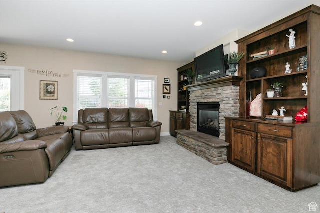 225 E 620 S, Smithfield, UT 84335 - living area featuring light colored carpet, a stone fireplace, plenty of natural light, and recessed lighting
